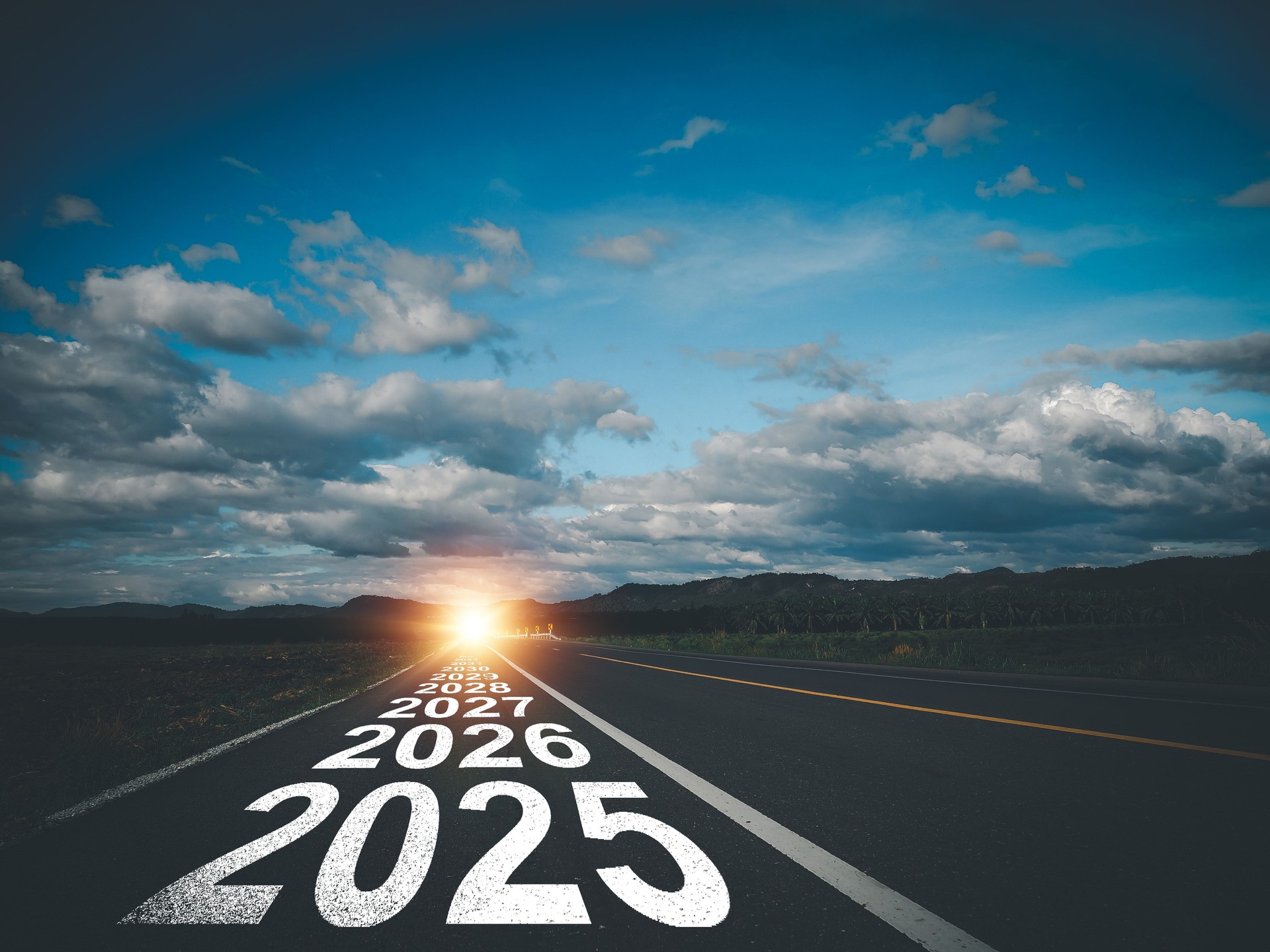 Open road with future years marked on the pavement, symbolizing long-term nonprofit strategy planning and growth toward 2030